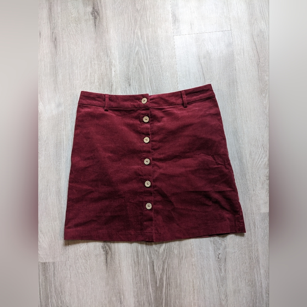 Maroon skirt.